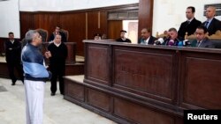 FILE - Al Jazeera journalist Mohamed Fahmy speaks before the judge during his retrial at a court in Cairo February 12, 2015. 