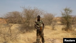 FILE - A Nigerien soldier takes a position during Flintlock 2014, a U.S.-led international training mission for African militaries, in Diffa, March 6, 2014.