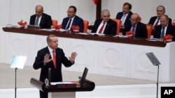 Turkey's President Recep Tayyip Erdogan addresses the parliament during its first session in Ankara, Oct. 1, 2017. 