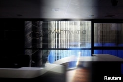The corporate logo of Smartmatic is seen at its offices in Caracas, Venezuela, Aug. 2, 2017.