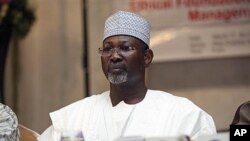FILE - Nigeria's electoral chief and academic Attahiru Jega attends a meeting with staff from the Independent National Electoral Commission in Abuja, March 17, 2011.