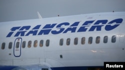 Passengers are seen inside a Transaero Boeing 737 aircraft at Kyiv International Airport in Kyiv, Ukraine, Sept. 25, 2015. 