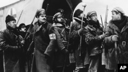 FILE - In this 1`965 image provided by MGM, Yuri Zhivago, played by Omar Sharif (2nd from L), is shown arriving with replacement Russian troops in a scene from the film 'Doctor Zhivago.'