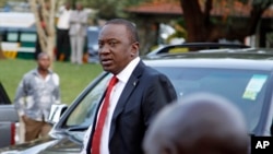 Presidential candidate Uhuru Kenyatta arrives to take part in a televised debate, in Nairobi, February 11, 2013.