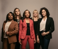 Fawn Weaver (center in red) with her leadership team at Uncle Nearest Premium Whiskey, including master distiller Victoria Eady Butler (far left), the great‐great‐granddaughter of Nearest Green. (Photo courtesy Uncle Nearest Premium Whiskey)