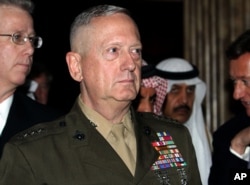 U.S. Gen. James Mattis, commander of U.S. Central Command, walks with other delegates, Dec. 4, 2010, at the International Institute for Strategic Studies' global security forum in Manama, Bahrain.