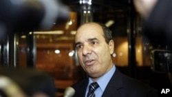 Ibrahim Dabbashi, Libya's deputy ambassador at the United Nations, speaks to reporters at the entrance to the Libyan Mission in New York February 21, 2011