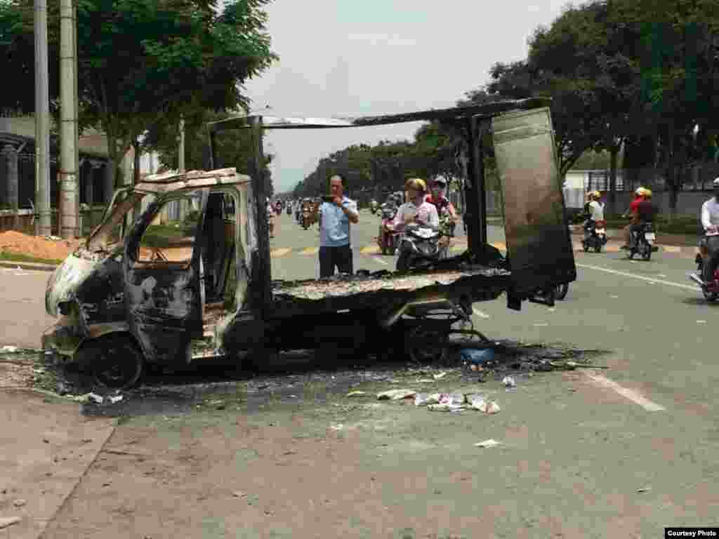 Protesters set truck on fire during a protest against China in the southern province of Binh Duong.