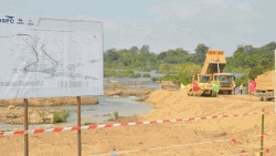 Workers WithTrucks Constructing The Waterway for Don Sahong Hydropower Dam