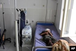 An Afghan boy is treated at a hospital following an airstrike in Kunduz province, northern Afghanistan, April 2, 2018.