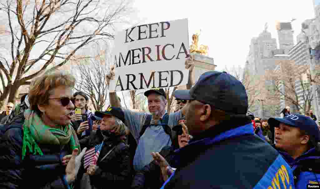 A man holds an anti-gun control sign during a &quot;March For Our Lives&quot; demonstration in New York, March 24, 2018.