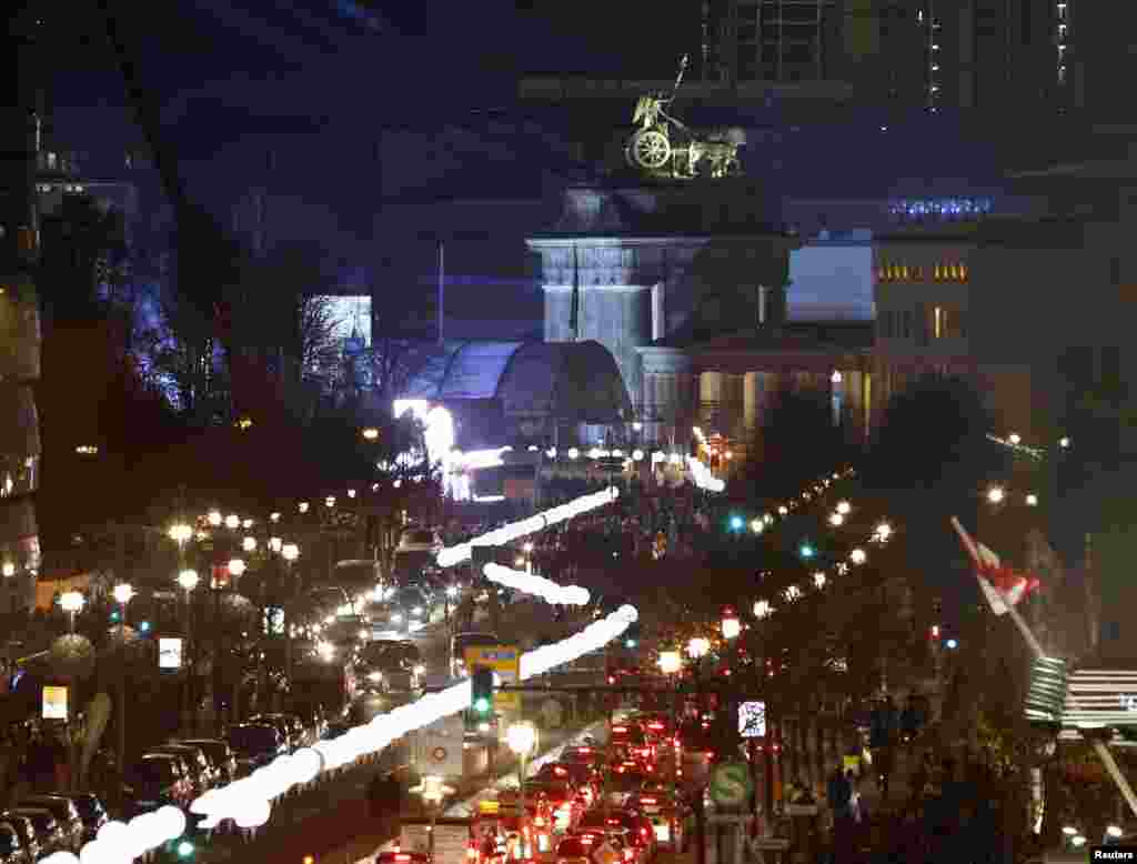The installation &#39;Lichtgrenze&#39; (Border of Light) along a former Berlin Wall location is illuminated near the Brandenburg Gate in Berlin, Nov. 7, 2014. 