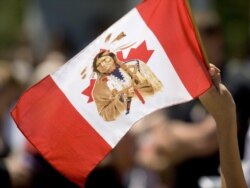 Canada flag with North American Indian image is waved during an Aboriginal Day of Protest in Toronto, June 29, 2007.