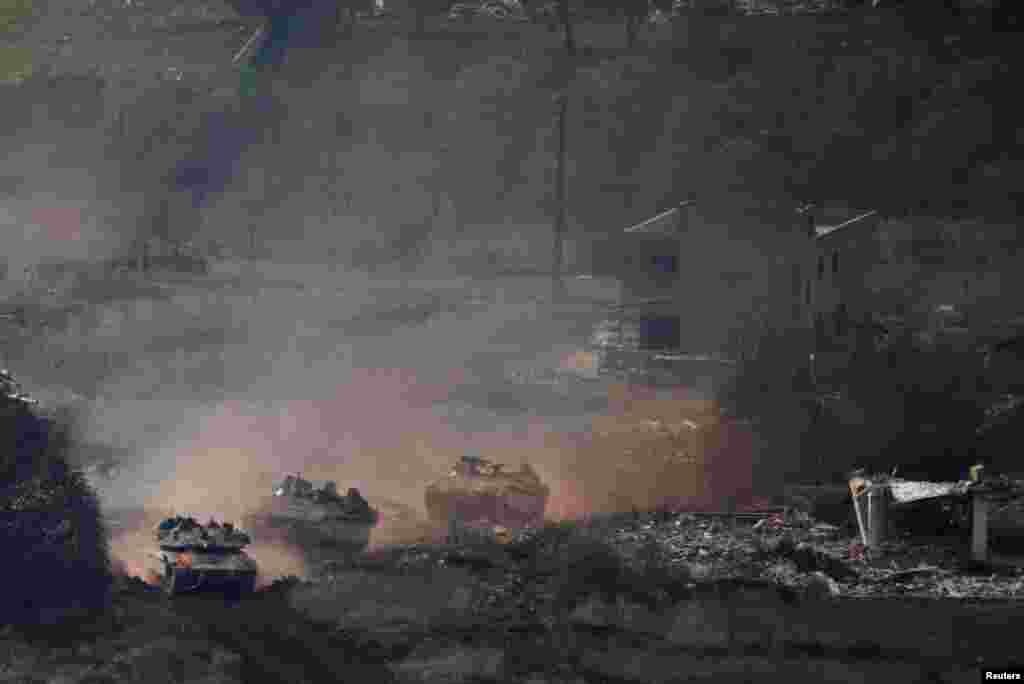 Israeli tanks return from southern Lebanon, following the ceasefire between Israel and Iran-backed group Hezbollah, as seen from northern Israel.