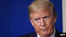 US President Donald Trump reacts during the daily briefing on the novel coronavirus, which causes COVID-19, in the Brady Briefing Room of the White House on April 22, 2020, in Washington, DC. (Photo by MANDEL NGAN / AFP)