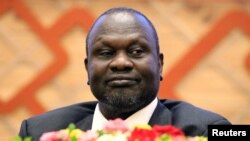  Riek Machar madugun 'yan tawaye wanda yanzu zai koma kan tsohon mukaminsa na mataimakin shugaban kasa a wata sabuwar yarjejeniyar da suka kulla a Uganda