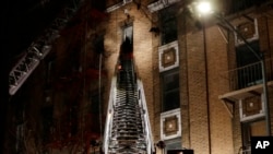 Firefighters respond to a deadly fire, Dec. 28, 2017, in the Bronx borough of New York. The New York City mayor's press secretary says several people have died and several more have been injured.