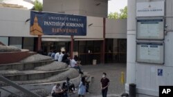 Students gather at Tolbiac Pantheon Sorbonne University in Paris, France, Sept. 17, 2020, where overcrowded universities have seen the emergence of at least a dozen of virus hotspots, and the number of infections has steadily increased in recent weeks.