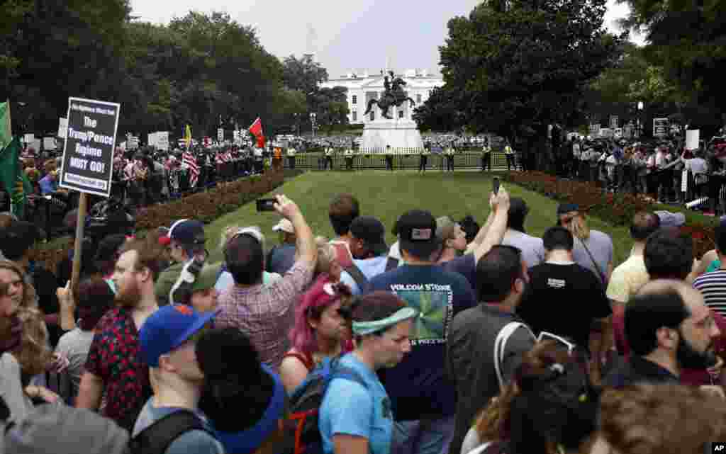 Demonstrators rally near the White House on the one year anniversary of the Charlottesville "Unite the Right" rally, Sunday, Aug. 12, 2018, in Washington.