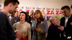 Pro-gay rights activists wait for exit poll results following a same-sex marriage referendum, in Ljubljana, Slovenia, Dec. 20, 2015.