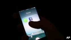 FILE - The Facebook app icon is shown on an iPhone in New York.