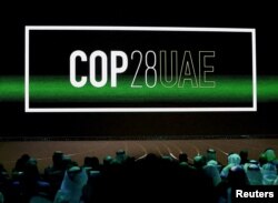 FILE - 'Cop28 UAE' logo is displayed on a screen at a climate conference in Abu Dhabi on Jan. 16, 2023. The U.N. Climate Change Conference, known as COP28, is scheduled for the end of November.