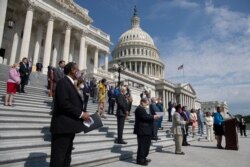 Rep. Karen Bass joined by House Speaker Nancy Pelosi, and other House Democrats spaced for social distancing, speaks during a news conference on the House East Front Steps on Capitol Hill in Washington, June 25, 2020.