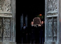 Late Spanish dictator Francisco Franco's relatives carry his coffin after its exhumation at The Valle de los Caidos (The Valley of the Fallen) in San Lorenzo de El Escorial, Spain, Oct. 24, 2019.