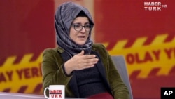 In this image from TV, Hatice Cengiz, who is Turkish, reacts during an interview on Turkish television channel HaberTurk, Oct. 26, 2018, about the day her fiance, Saudi journalist Jamal Khashoggi entered the Saudi Arabia Consulate on Oct. 2, and was killed inside.