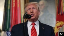 President Donald Trump speaks in the Diplomatic Room of the White House in Washington, Sunday, Oct. 27, 2019. (AP Photo/Andrew Harnik)