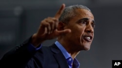 Former President Barack Obama, making a pitch for Democratic votes in the midterm elections, speaks during a rally in Detroit, Oct. 26, 2018. 