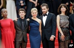 From left, Rokia Traore, Xavier Doran, Sienna Miller, Jake Gylenhaal and Sophie Marceau arrive for the opening ceremony and the screening of the film La Tete Haute (Standing Tall) at the 68th international film festival, Cannes, southern France, Wednesday