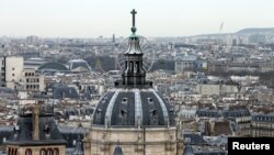 FILE- A city view shows the dome at La Sorbonne University as part of the skyline in Paris, France, March 30, 2016. 