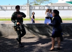 Philippine security personnel patrol near U.S Visa applicants after an Improvised Explosive Device (IED) was found near the US Embassy in Manila, Philippines November 28, 2016.