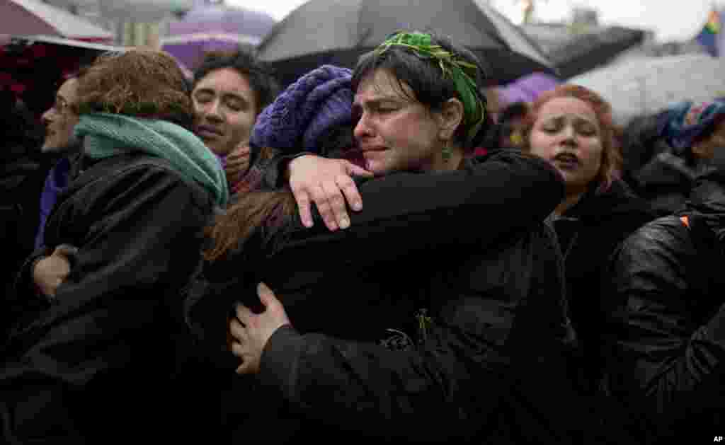 Women embrace during a demonstration against gender violence in Buenos Aires, Argentina, Oct. 19, 2016. 