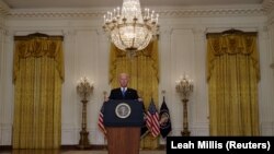 U.S. President Joe Biden delivers remarks about global transportation supply chain bottlenecks.