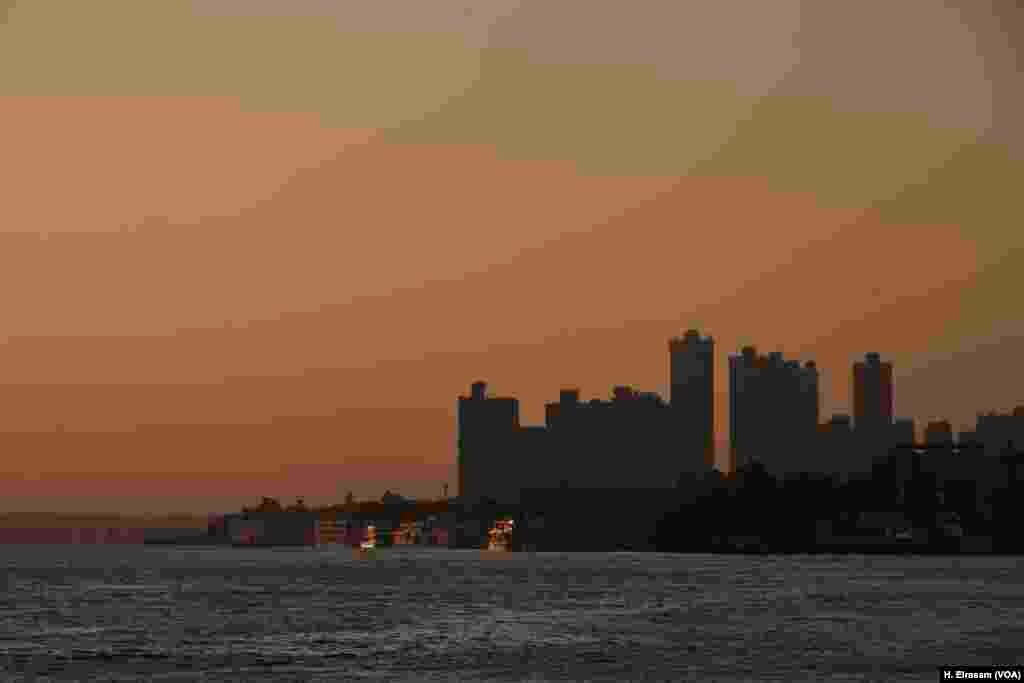 Apartment towers stand in Maadi, an affluent Cairo suburb where riverfront property sells at a premium. For investors, the choice between putting big money into booming real estate and farmland is a no-brainer.