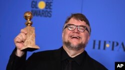 Guillermo del Toro poses in the press room with the award for best director - motion picture for "The Shape of Water" at the 75th annual Golden Globe Awards at the Beverly Hilton Hotel on Jan. 7, 2018, in Beverly Hills, Calif. 