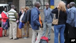FILE - Aid workers from various NGOs active in South Sudan arrive at Wilson airport in Nairobi, Kenya, July 13, 2016, from Juba.