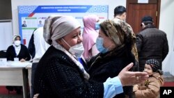 Voters gather at a polling station during the presidential election in Tashkent, Uzbekistan, Oct. 24, 2021. 