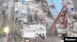 A tank fires a round, amid Russia's attack on Ukraine, in Soledar