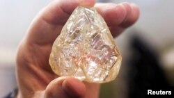 A 709-carat diamond, found in Sierra Leone and known as the "Peace Diamond", is displayed during a tour ahead of its auction, at Israel's Diamond Exchange, in Ramat Gan, Israel, Oct. 19, 2017. 