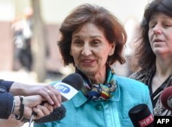 VMRO opposition party candidate Gordana Siljanovska-Davkova talks to the press after casting her vote for the presidential election in Skopje on April 21, 2019.