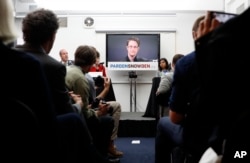 Edward Snoden giving video presentation from Russia.