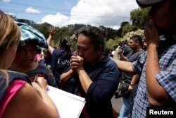Family members react as they wait for news of their loved ones after a fire broke at the Virgen de Asuncion home in San Jose Pinula, on the outskirts of Guatemala City, Guatemala, March 8, 2017.
