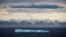 FILE - An iceberg floats past Bylot Island in the Canadian Arctic Archipelago, July 24, 2017.