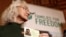 Debra Tice, the mother of American journalist Austin Tice, who went missing in Syria in 2012, holds a card with a photo of her son during a press conference in Damascus, Syria, Jan. 20, 2025. 