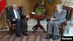 Lebanon's President Michel Sulaiman (L) meets with UN-Arab League peace envoy for Syria Lakhdar Brahimi at the presidential palace in Baabda, near Beirut, October 17, 2012. 