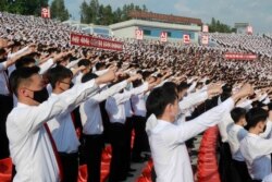 FILE - In this June 6, 2020 file photo, North Korean students stage a rally to denounce South Korea for sending anti-Pyongyang leaflets over the border.