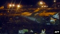 This handout picture released by Russia's Emergencies Ministry on Nov. 17, 2013, shows the crash site of a Boeing 737 plane at the airport of Kazan, western Tatarstan, Russia.